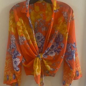 Blouse, kimono sleeve, orange color with floral print.